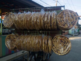 This food is made from grated and dried cassava, in Indonesian it is called opak