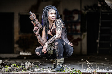 Tattooed gun girl in end time scenery