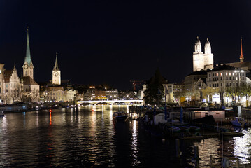 Fototapeta na wymiar Illuminated old town city of Zurich by night. Photo taken April 9th, 2021, Zurich, Switzerland.