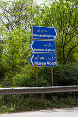 Fototapeta premium Islamabad city, traffic sign to Islamabad highway and Kashmir highway guiding the traffic in the proper direction