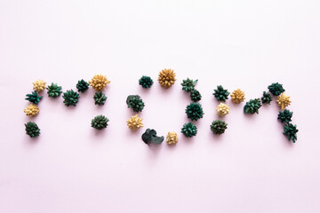 Writing MOM in flowers on light background. card mothers day flowers top view