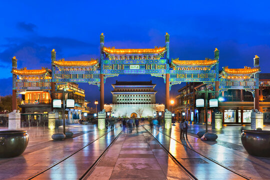 BEIJING-APRIL 24, 2013. Famous Qianmen Street at twilight. It is 840 meters long and 21 meters wide and has a history of over 570 years. Its buildings style resemble the late Qing Dynasty (1644-1911).