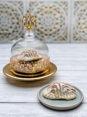 Desserts Eid al-Fitr, Kahk (Eid Cookies) Arabic filled Pistachio or nut called Maamoul Cookies. Side view.