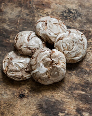 Chocolate meringue on a wooden background, top view. Copy space