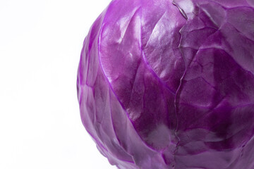 Fototapeta premium Close-up of whole fresh red cabbage head, isolated on white background