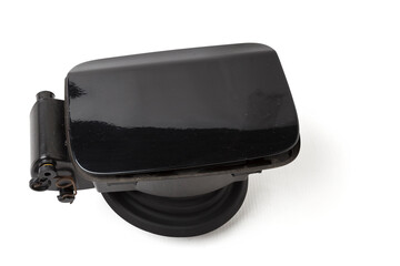 Detail of a black car body with rubber seal on a white isolated background in a photo studio gas tank cover spare part for sale at a car service or at an auto-parsing.