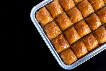 Turkish baklava with walnuts on a tray