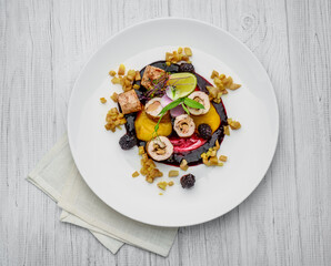 Roll stuffed with mushrooms and vegetables with berry sauce