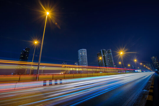 Long Exposure Shutter Speed Of Car Moving In Road