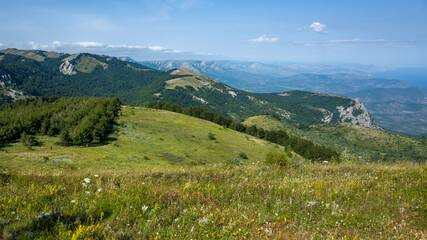 Fototapeta na wymiar View of the surrounding mountains from the top of the Demerdzhi mountain range in Crimea.