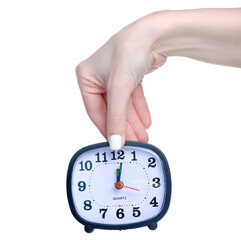 Table clock alarm clock in hand on white background isolation