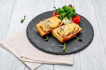 French toast ham cheese and salad on dish