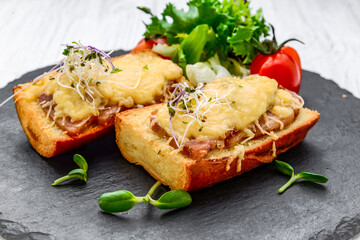 French toast ham cheese and salad on dish