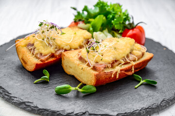 French toast ham cheese and salad on dish