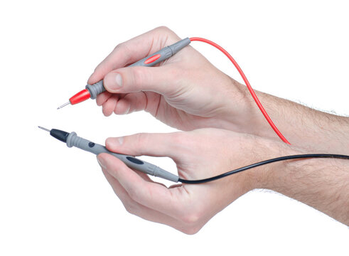 test leads for multimeter in hand on white background isolation