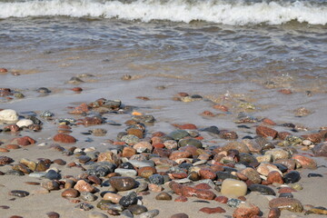Background and texture, granite stones at the water's edge.