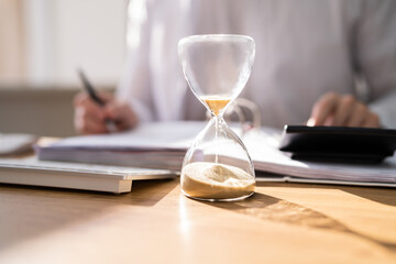 Accountant Calculating Invoice Bill In Time