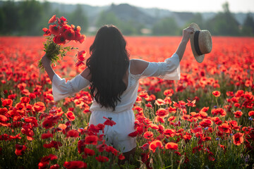 the girl walks in the poppy field