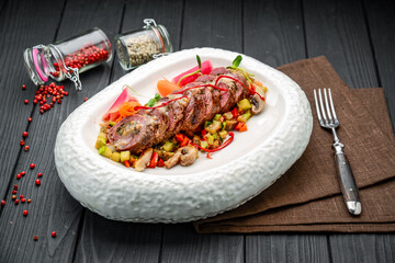 Veal roll stuffed with mushrooms with vegetable stew