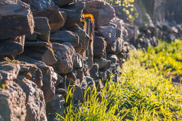 An uneven stonewall on the countryside