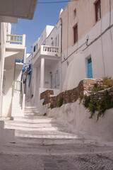 Obraz premium Empty cobbled streets, without people, whitewashed and white painted buildings in spring, in Mykonos town, Cyclades islands in the Aegean Sea. Charming place.
