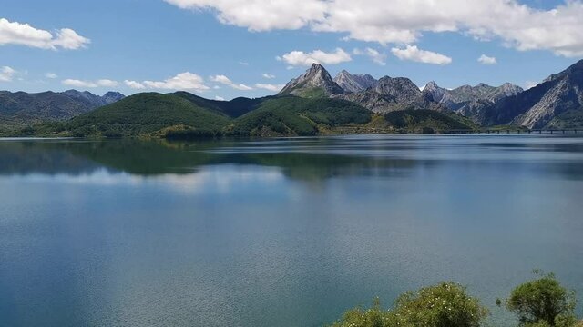Ria&ntilde;o reservoir swamp in flooded valley landscape surrounded by mountains and forests, in spring