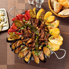 Sac dish with eggplant, potato, tomato. Sac Tava, Sac Kavurma