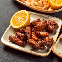 Grilled chicken dish with lemon close up