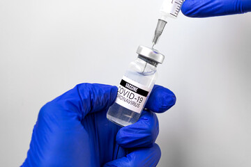 Coronavirus vaccine and syringe close-up background, healthcare concept