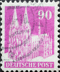 GERMANY - CIRCA 1948: a postage stamp from Germany, showing the historic building of Cologne...