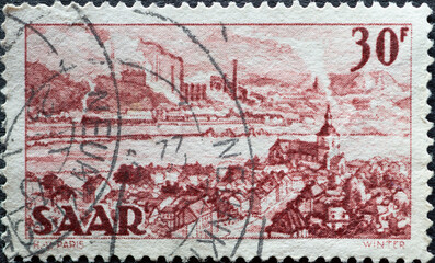 GERMANY - CIRCA 1951: a postage stamp from Germany area Saar, showing a drawing of the town of St....
