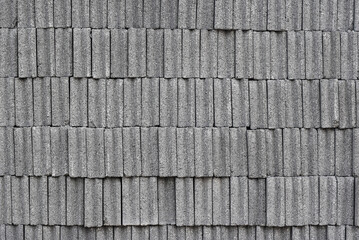 The texture of the gray 
cement brick pile