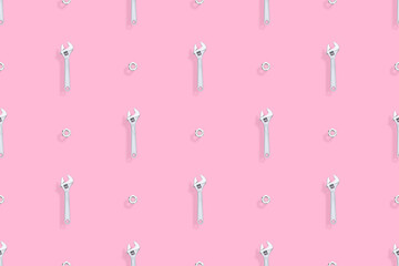 Adjustable metal wrench seamless pattern. Background from a metal wrench and nut. 