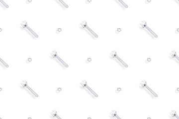 Adjustable metal wrench seamless pattern. Background from a metal wrench and nut. 