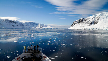 Snow covered Mountains and Icebergs in the Antarctic Peninsula on Antarctica.