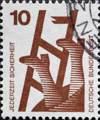 GERMANY - CIRCA 1971: a postage stamp from Germany, showing Motive for accident prevention. Text: Security at all times. Person falls from broken ladder
