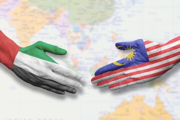 Malaysia and United Arab Emirates - Flag handshake symbolizing partnership and cooperation