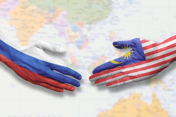 Malaysia and Russia - Flag handshake symbolizing partnership and cooperation