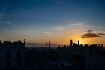 Fototapeta na wymiar vanilla sky over parisian roofs 