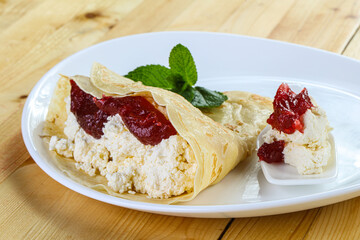 Pancake with cottage cheese and jam