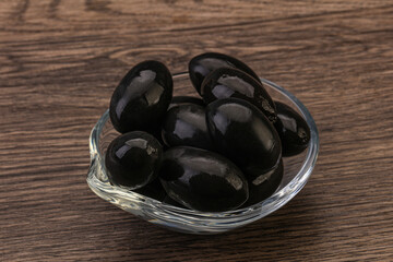 Pickled black olives in the bowl