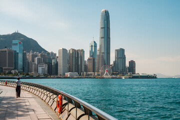 Fototapeta na wymiar Waterfront Promenade with Victoria Harbour and skyline of Hong kong Island