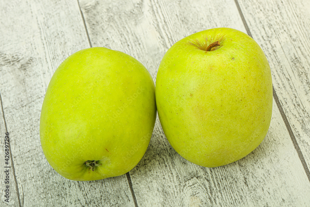 Wall mural two ripe green sweet apples