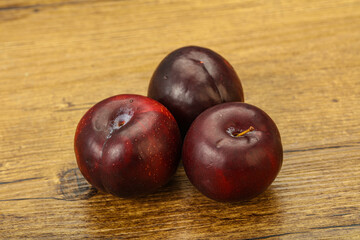 Ripe sweet plum fruit heap