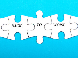 Back to work phrase in 3 pieces paper puzzle on blue background. Business concept.