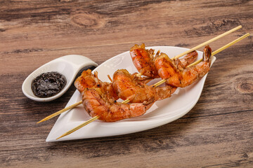 Grilled prawn skewer with pepper sauce