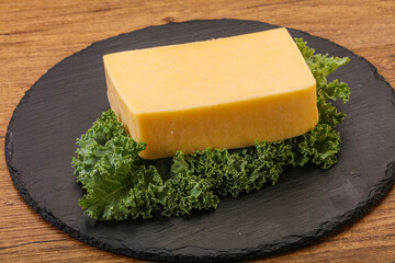 Tasty yelloow Tilsiter cheese brick