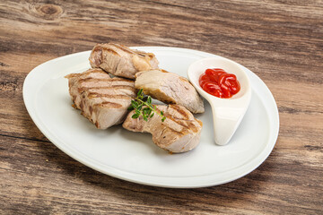 Grilled pork tenderlion with tomato sauce