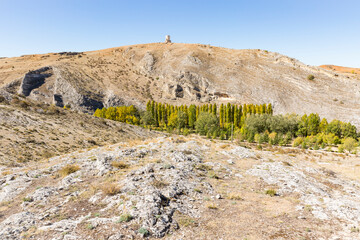 summer landscape with the Ucero river and the islamic watchtower in Uxama hill next to Burgo de...