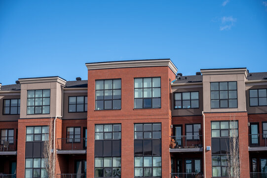 Modern condominium buildings in an urban environment. 